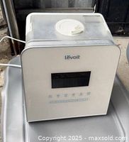 Front and top view of Levoit ultrasonic cool mist humidifier showing display, controls, top-fill lid and power cord
