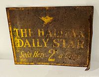 Front of painted metal sign showing text and star graphic