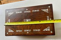 Top view of box with measuring tape showing width about 14 inches