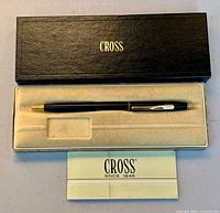 Pen in open case with leaflet visible