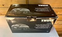 Closed Thule Quest retail box showing branding and product image