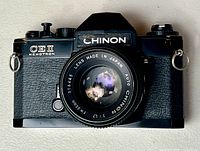 Front view of Chinon CE II Memotron camera with lens attached