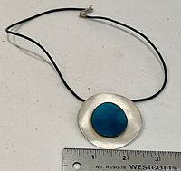 Full view of necklace showing pendant and cord