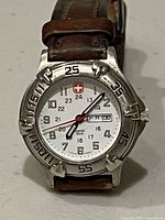 Front view showing dial, bezel, and strap