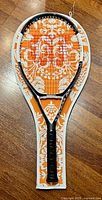 Full view of Wilson nCode n6 racket inside orange floral case