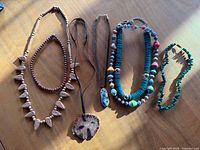 All six necklaces laid out together