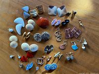 Overhead view of all earring pairs laid out on tabletop