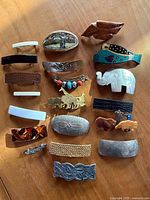 Group shot of all 18 hair clips laid out on wooden surface