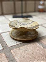 Side view showing pedestal form and glaze