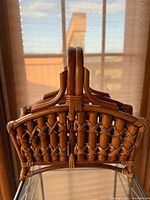 Front view of bamboo rattan basket showing lattice weave and feet