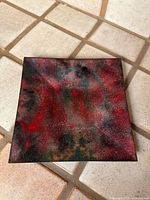 Full view of square enameled copper platter showing overall coloration