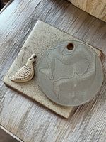 Square tile, round plaque, quail ornament grouped