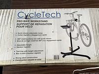 Front of sealed CycleTech pro bike workstand box showing product image and features list