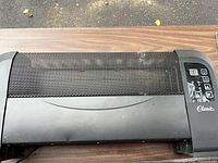 Front view of Classic electric heater showing mesh grille and control panel