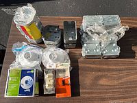 All items grouped on table showing lampholders, wiring devices and metal boxes