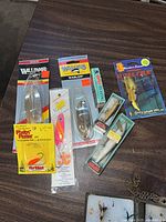 Carded lures including Williams Wabler, spoon and jig pack