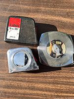 Group shot of three measuring tapes showing overall condition and size comparison