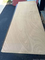 Top view of full length of wood slab door showing grain and overall condition