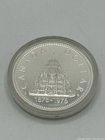 Reverse showing Library of Parliament design and dates 1876-1976