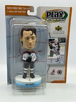 Front view of sealed Joe Sakic bobblehead in package