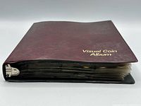Closed maroon Visual Coin Album binder
