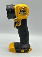 Left side profile of DEWALT DCL040 work light showing brand logo, 20V MAX marking, metal hook, battery interface