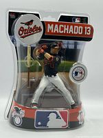 Front of sealed Manny Machado Imports Dragon figure showing player pose and accessories