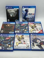 Seven PS4 game cases front view showing titles