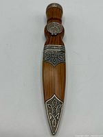 Knife in sheath, full view