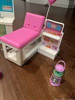 Exam table and parlour shelving unit with gumball dispenser