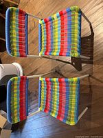 Top view of both rainbow weave chairs showing seats