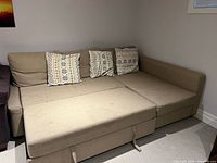 Sofa with sleeper portion extended showing full bed surface
