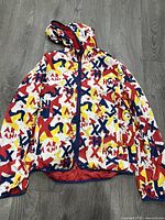 Front view of Armani Exchange windbreaker showing pattern, hood and zipper