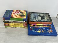 Stacked view of entire lot showing variety of titles and formats