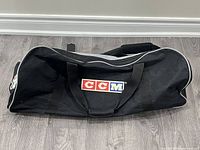 Full view of CCM black duffel bag showing logo and overall condition