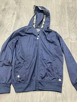 Full view of navy EA7 hoodie front side