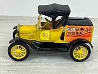 Passenger side view showing graphics, wheels, coin slot