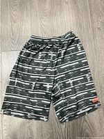 Front view of Nike SB youth trunks showing pattern and logo