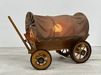 Left front view of covered wagon lamp illuminated
