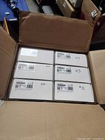 Six boxed keypads inside shipping carton