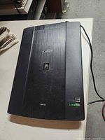 Top view of Canon LiDE 220 scanner showing model and branding