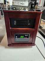 Front view showing wood cabinet, display, controls