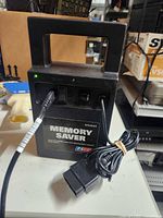 Front view of EZ-RED MS4000 memory saver showing handle, power switch, cable, labeling