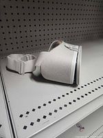 Left side view showing head strap and overall form