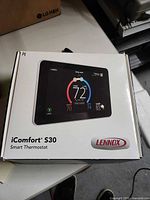 Front of Lennox iComfort S30 Smart Thermostat retail box