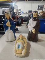 Front view of three nativity blow molds: Mary, Joseph, Baby Jesus