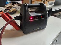 Front view showing LEDs, power switch, label and handle