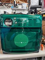 Front view showing translucent green door, control buttons, and digital display