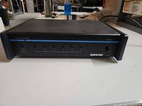 Front view of Shure FP16A showing six output indicators and power LED