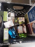 Top view of crate showing HP 952XL box, Dell Series 5 box, other cartridges